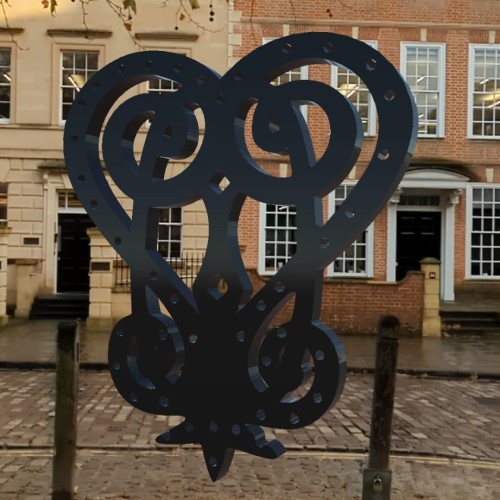 Screenshot from the Decolonising Memory augmented reality app, depicting a heart-shaped object imposed on Queen Square, Bristol